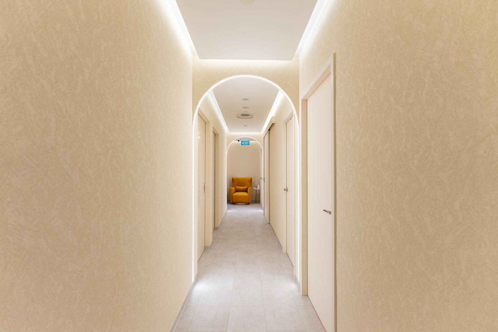 Arched corridor leading to the treatment rooms